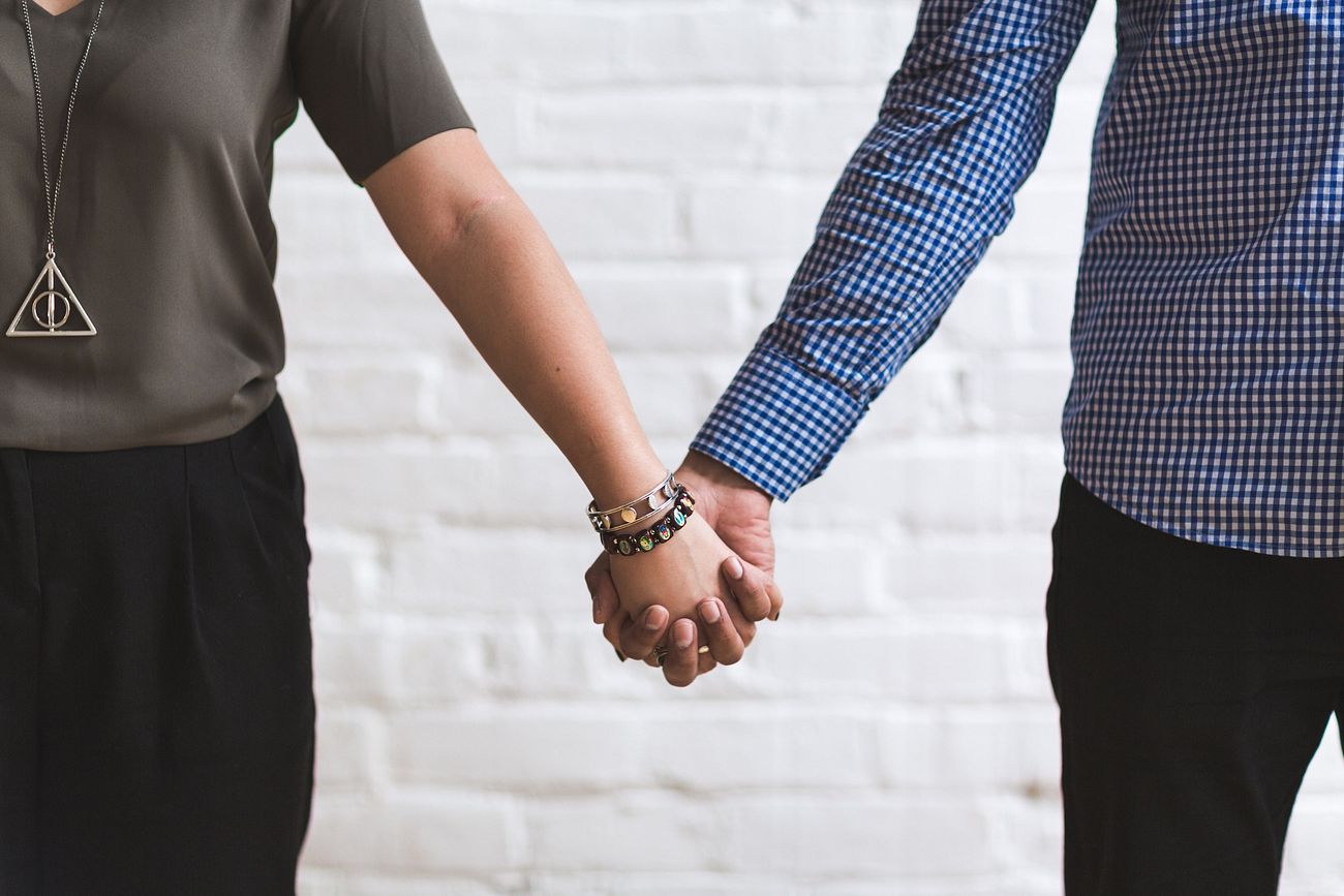 Couple holding hands, strong relationship